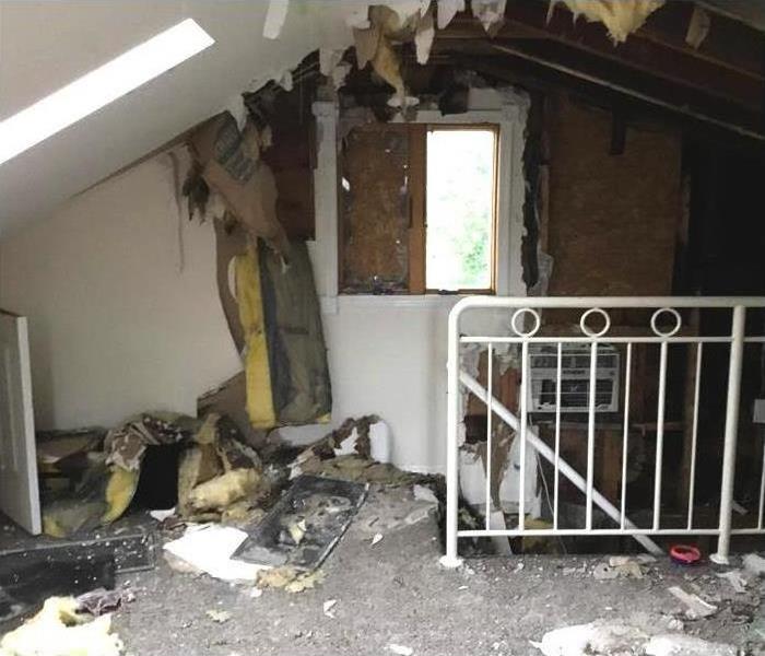 Fire damaged interior during fire damage restoration assessment and security